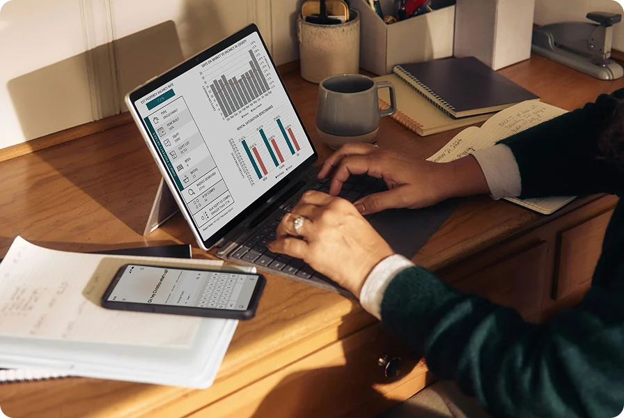 A person reviewing rental market charts on a laptop
